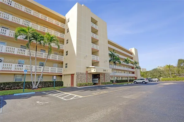 a city street lined with buildings and trees