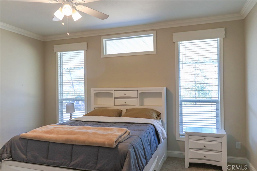24000 Oak Cir Drive Wildomar, CA 92595 - Photo 18 of 22 a bedroom with a bed and a window