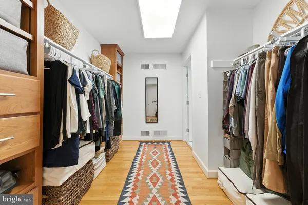 a bedroom with furniture and a rug