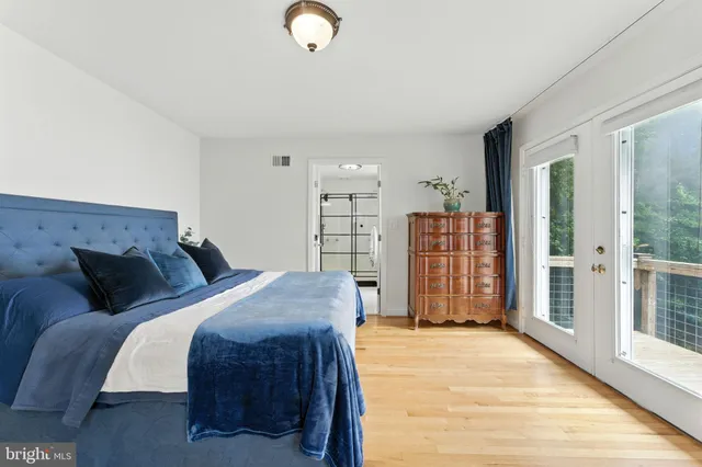 a bedroom with furniture and a rug