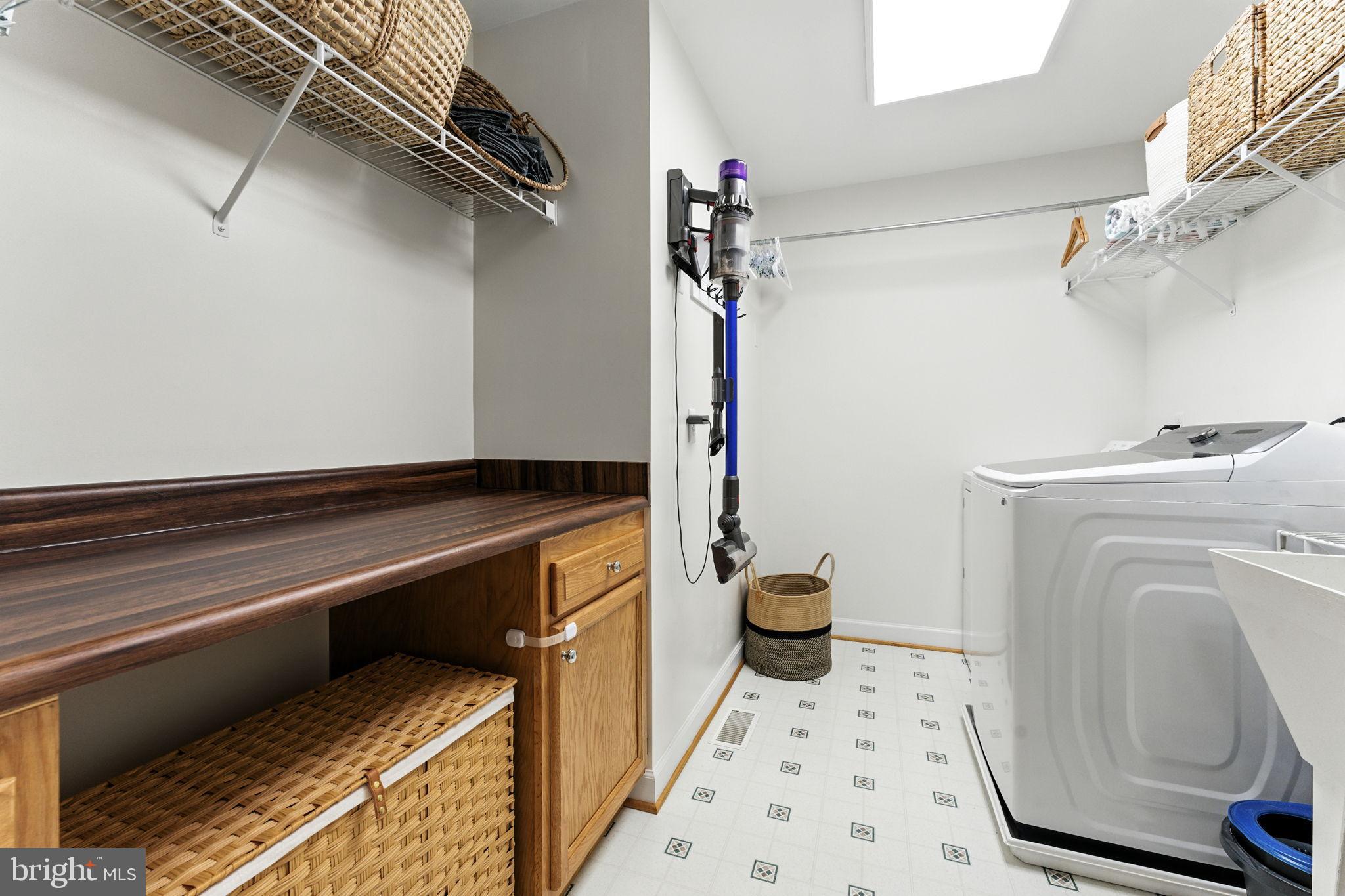 46 Rock Ridge Lane Chester Gap, VA 22623 - Photo 25 of 66 Bright and functional laundry space with storage.