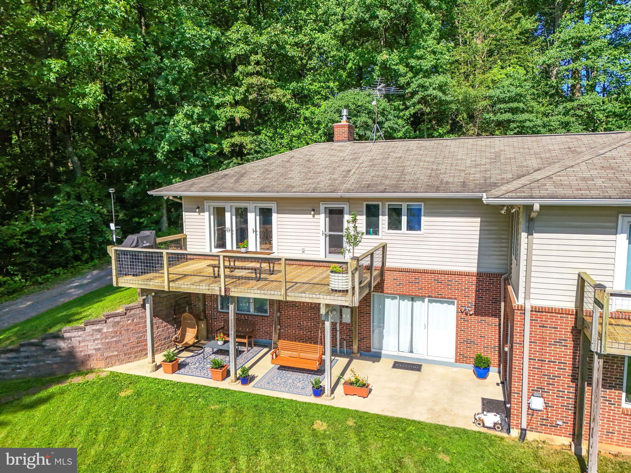 46 Rock Ridge Lane Chester Gap, VA 22623 - Photo 3 of 66 Charming home nestled in lush greenery.