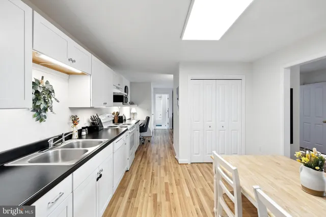 a view of a room with wooden floor and a porch