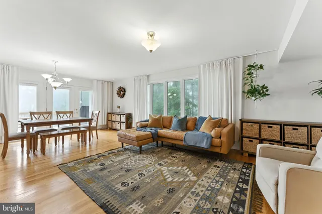 a living room with furniture flat screen tv and a fireplace