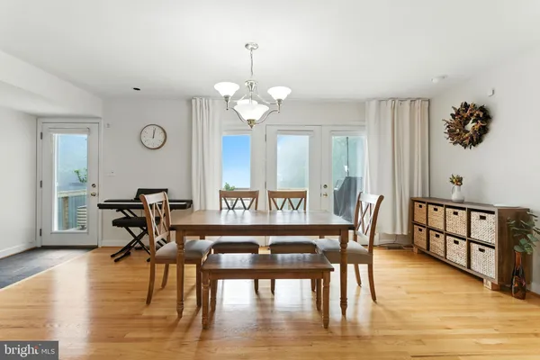 a large kitchen with a table and chairs