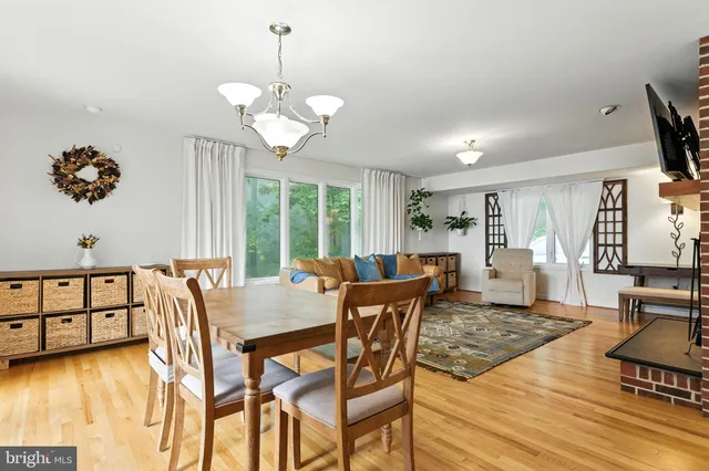 a large kitchen with a table and chairs