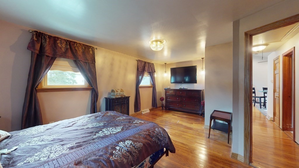 8 Fernwood Road Billerica, MA 01821 - Photo 11 of 23 a bedroom with a bed and a television