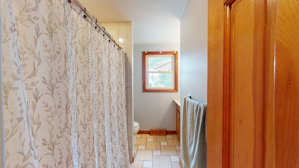 8 Fernwood Road Billerica, MA 01821 - Photo 12 of 23 a bathroom with a shower curtain and a curtain
