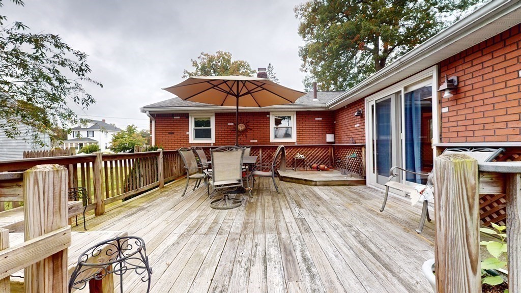 8 Fernwood Road Billerica, MA 01821 - Photo 15 of 23 a view of a house with a patio and wooden flooring