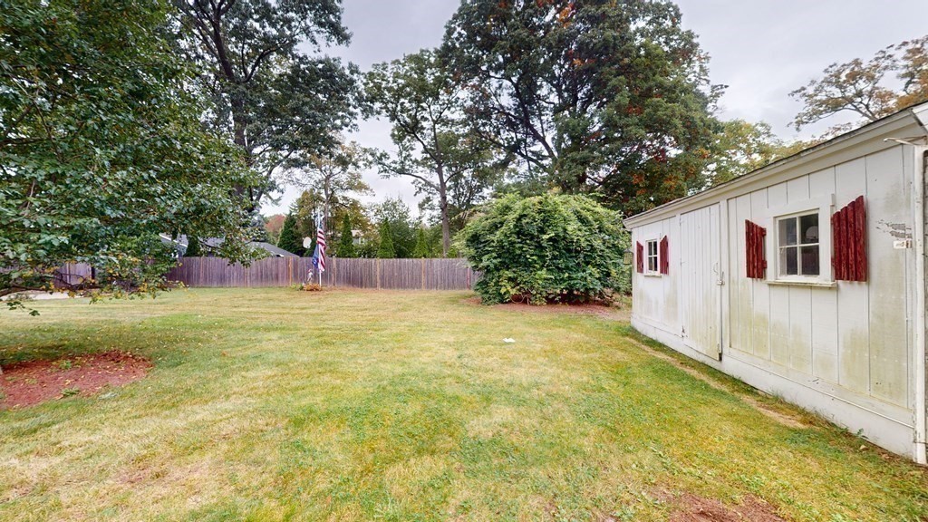 8 Fernwood Road Billerica, MA 01821 - Photo 18 of 23 a view of a backyard with plants and large trees
