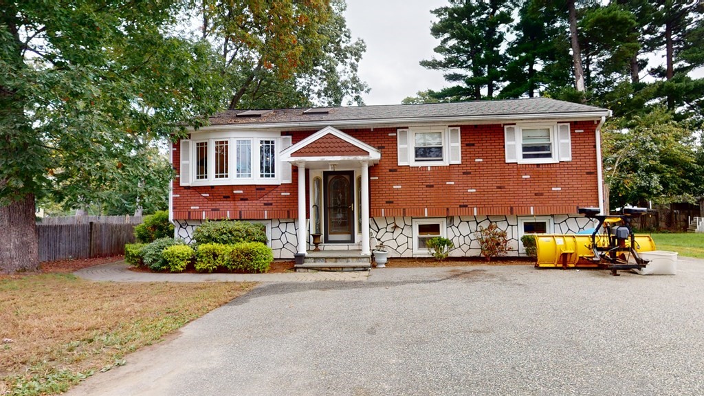 8 Fernwood Road Billerica, MA 01821 - Photo 2 of 23 a front view of a house with a garden and plants