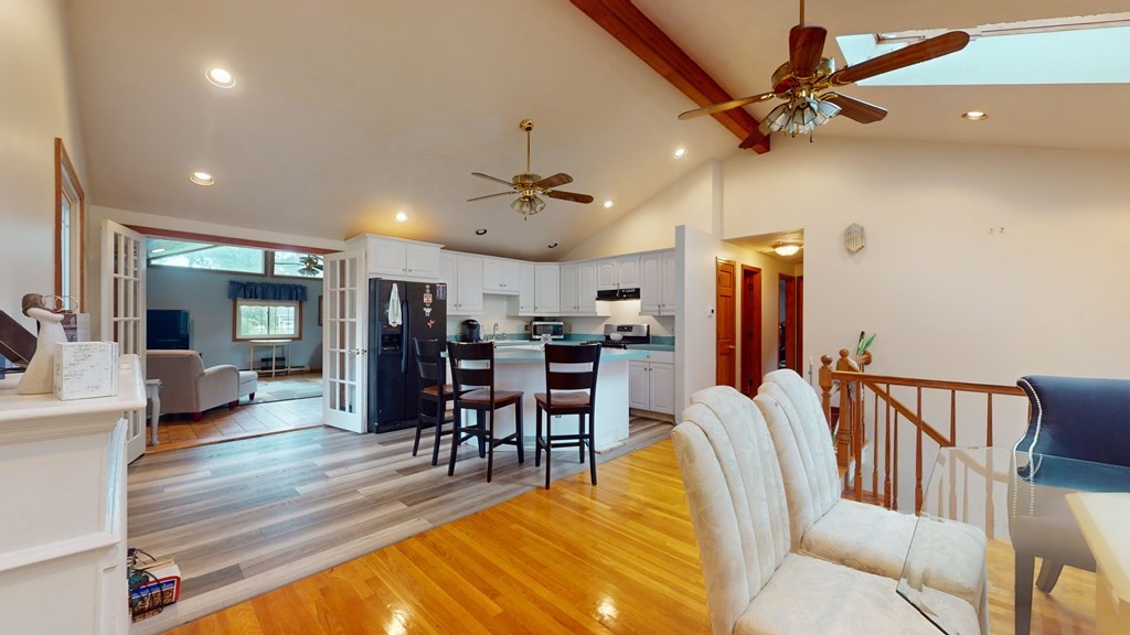 8 Fernwood Road Billerica, MA 01821 - Photo 5 of 23 a view of a dining room with furniture a chandelier and wooden floor