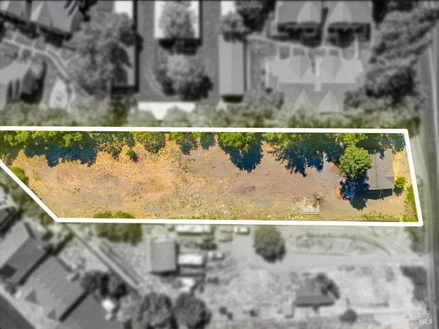 a kitchen with a sink and a wooden cabinets