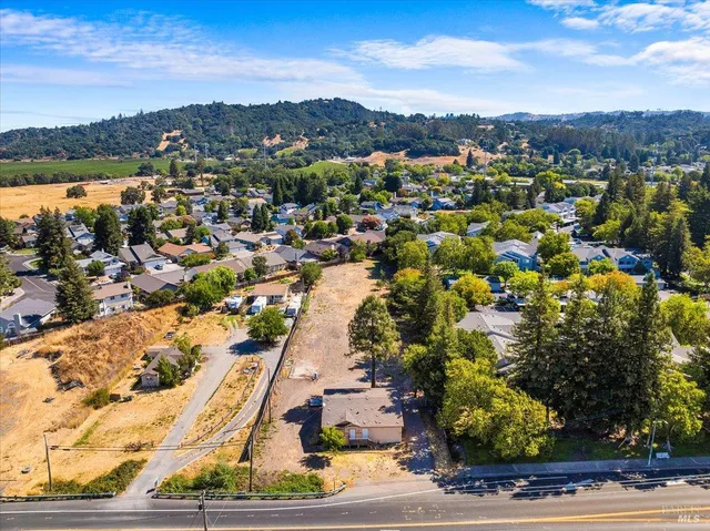 a aerial view of a house with a lake view
