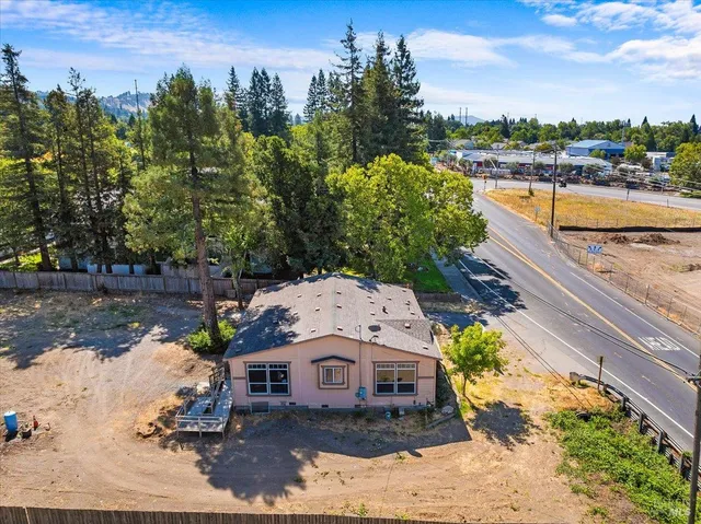 a view of a yard with a tree