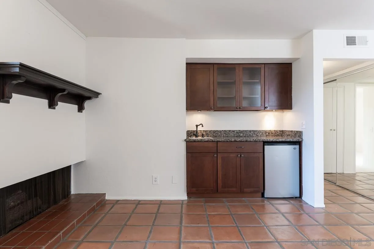 6314 Friars Road, Unit 301 San Diego, CA 92108 - Photo 11 of 31 a kitchen with a stove and a cabinets
