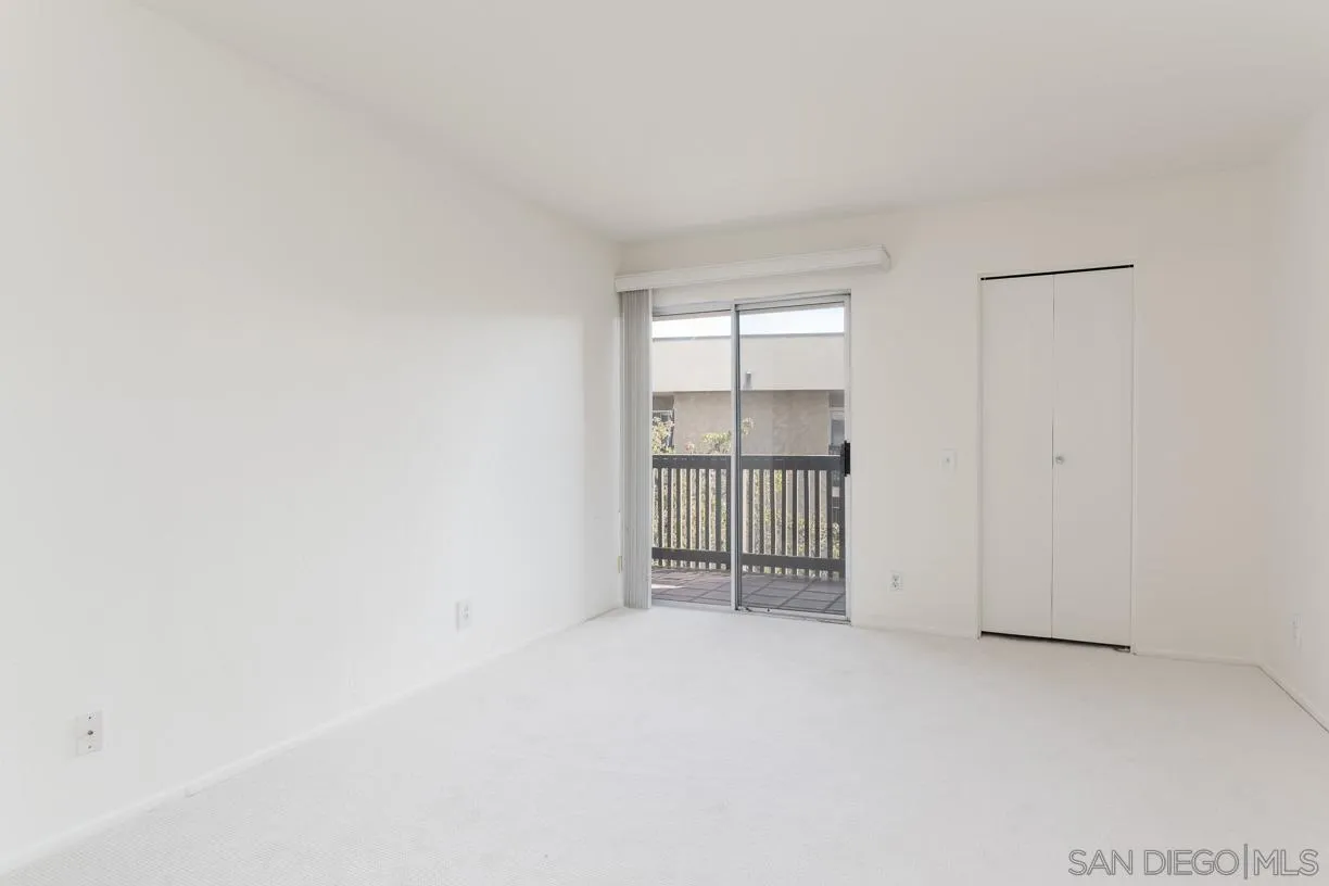 6314 Friars Road, Unit 301 San Diego, CA 92108 - Photo 14 of 31 an empty room with windows