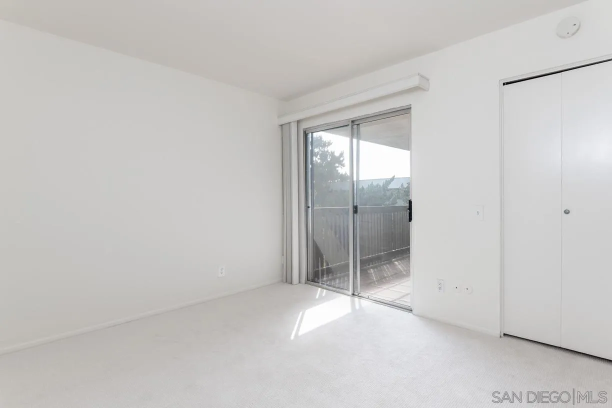 6314 Friars Road, Unit 301 San Diego, CA 92108 - Photo 17 of 31 a view of an empty room with sliding glass door
