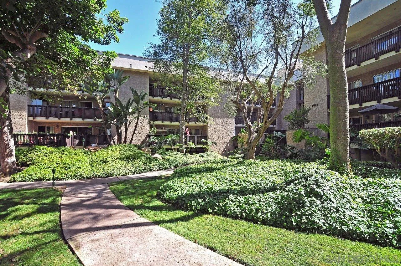 6314 Friars Road, Unit 301 San Diego, CA 92108 - Photo 20 of 31 a front view of a house with a yard
