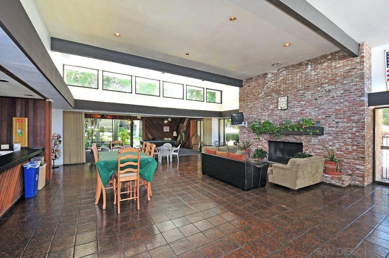 6314 Friars Road, Unit 301 San Diego, CA 92108 - Photo 25 of 31 a view of a patio with dining table and chairs with a small yard