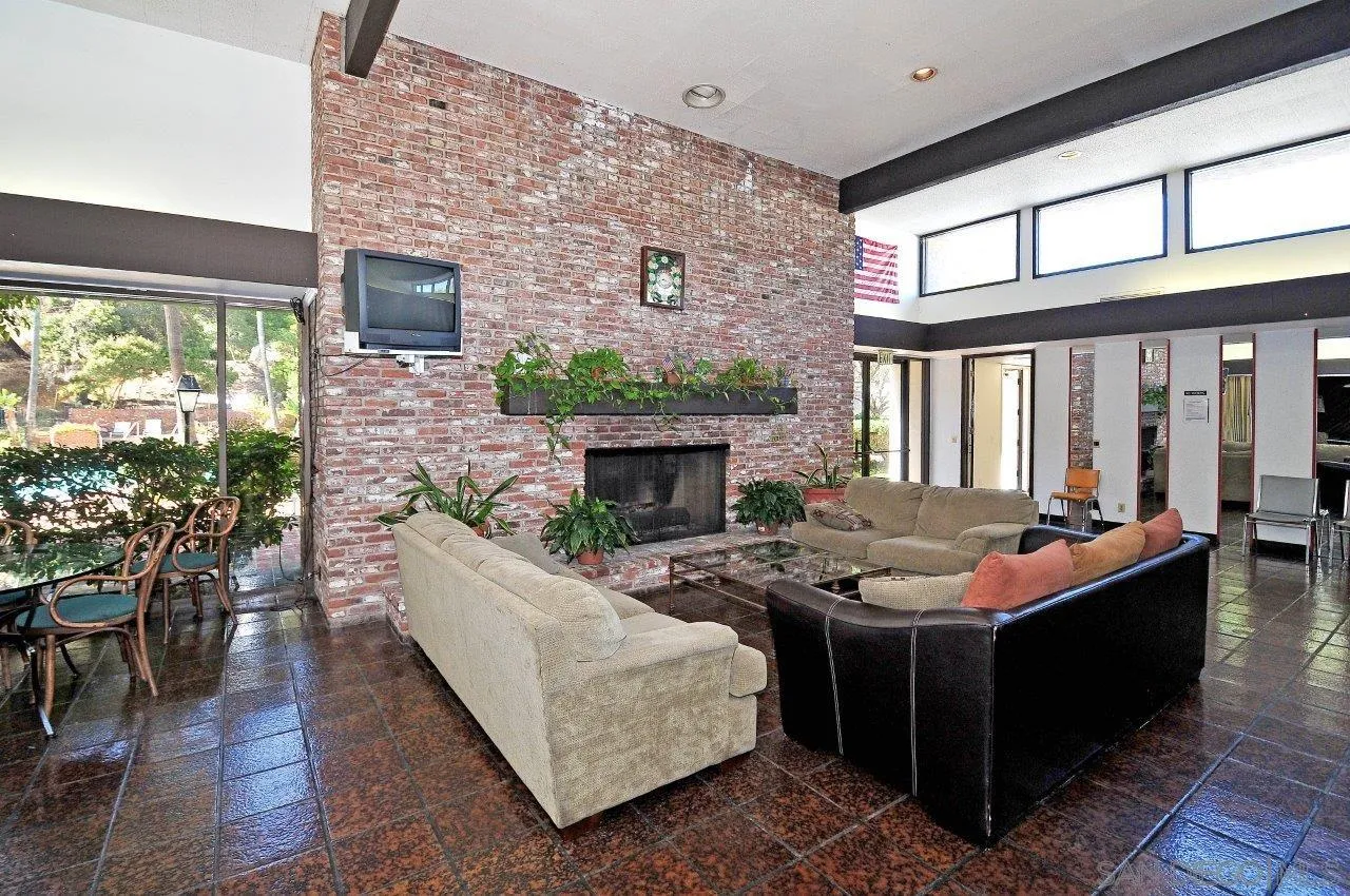 6314 Friars Road, Unit 301 San Diego, CA 92108 - Photo 26 of 31 a living room with furniture and a fireplace
