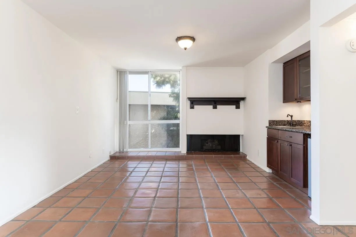 6314 Friars Road, Unit 301 San Diego, CA 92108 - Photo 9 of 31 a view of empty room with a fireplace and windows