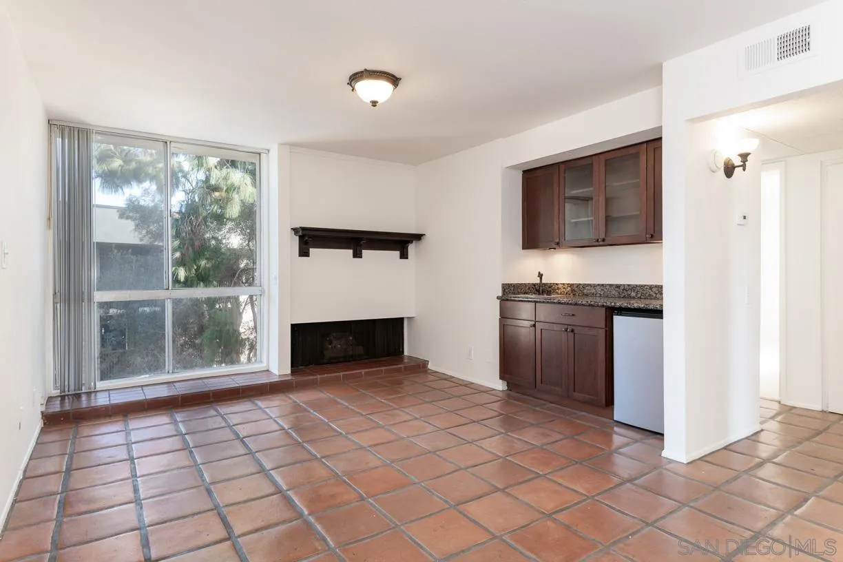 6314 Friars Road, Unit 301 San Diego, CA 92108 - Photo 10 of 31 a view of open kitchen with granite countertop cabinets and stainless steel appliances