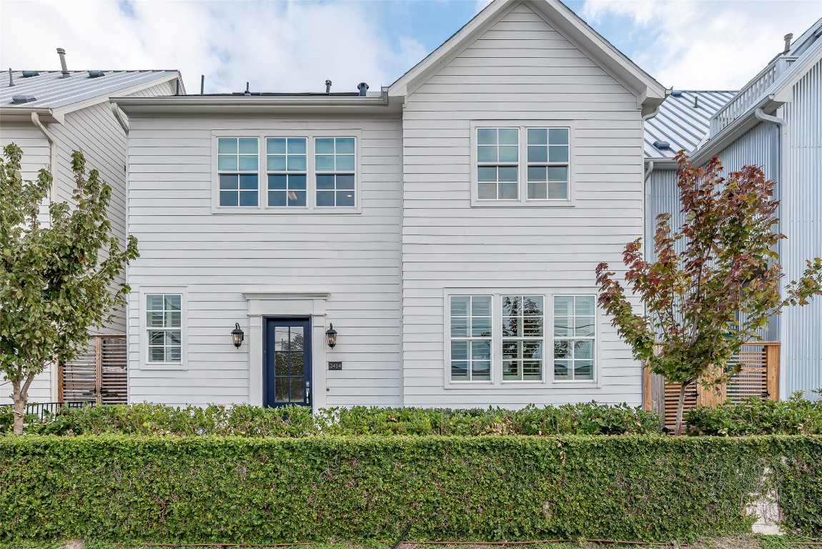 front view of a house with a garden
