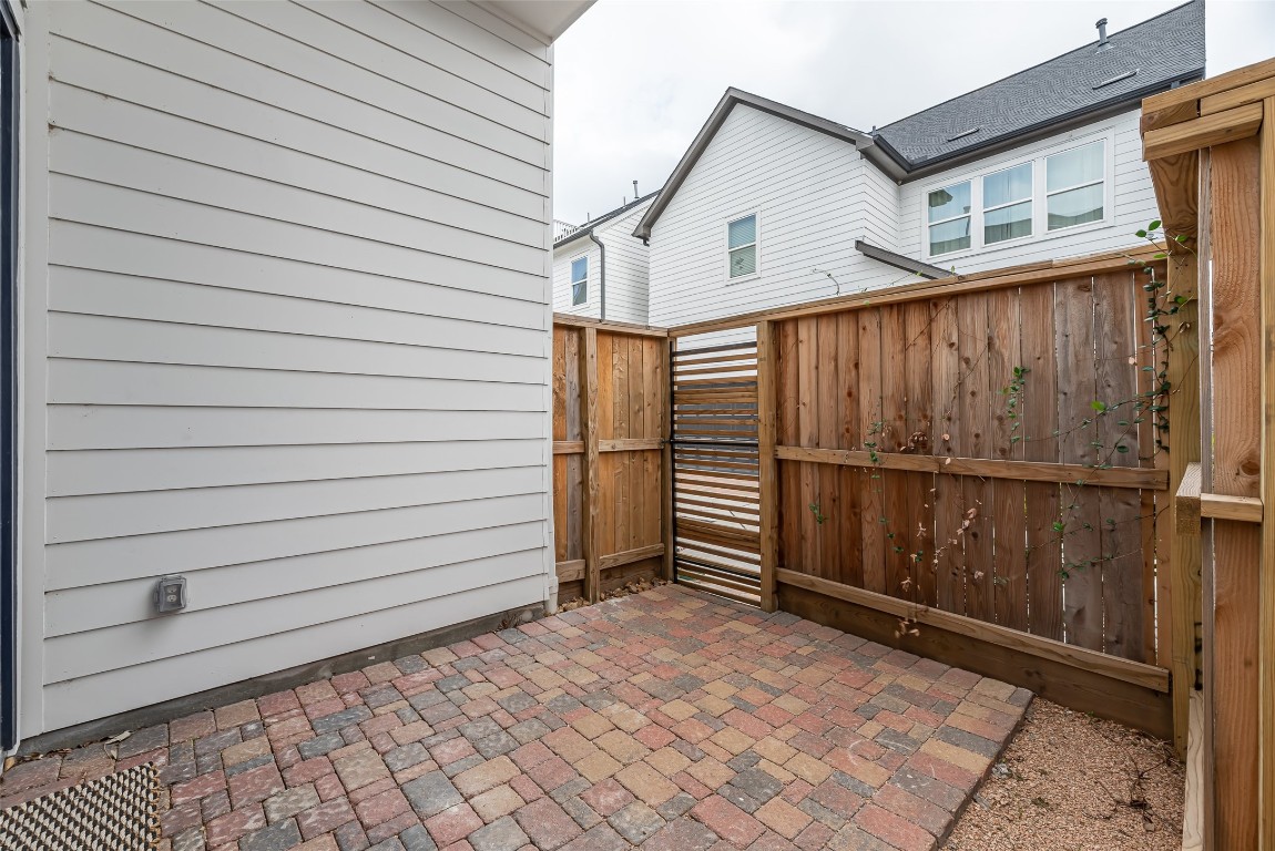 2414 Hollister Road Houston, TX 77080 - Photo 20 of 23 a view of a house with a wooden fence