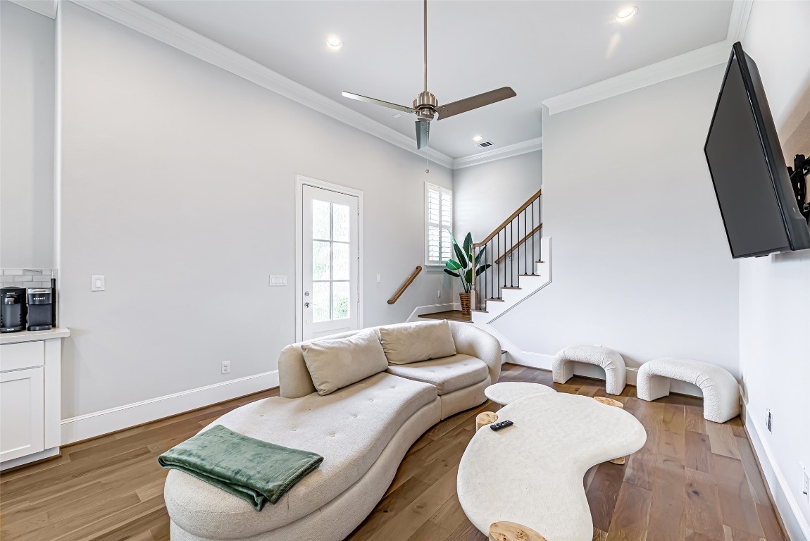 2414 Hollister Road Houston, TX 77080 - Photo 6 of 23 a living room with furniture and a flat screen tv