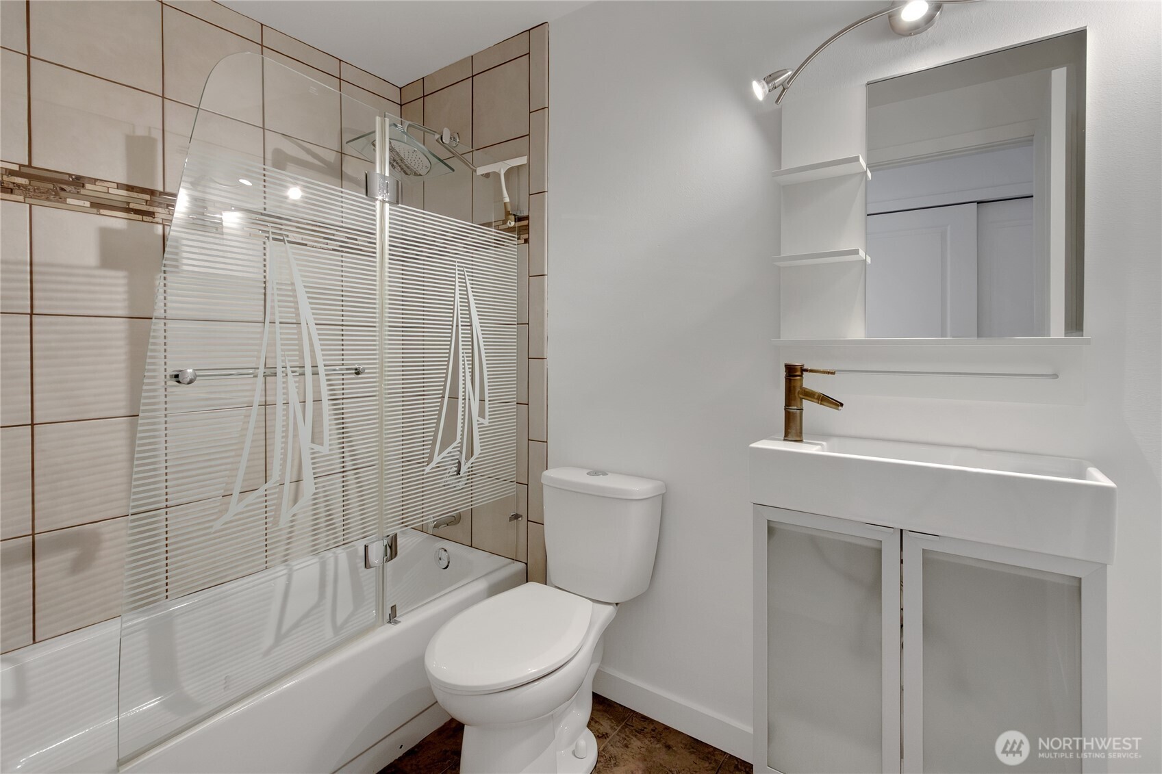 2356 South Angeline Street Seattle, WA 98108 - Photo 17 of 35 a bathroom with a shower a toilet and sink