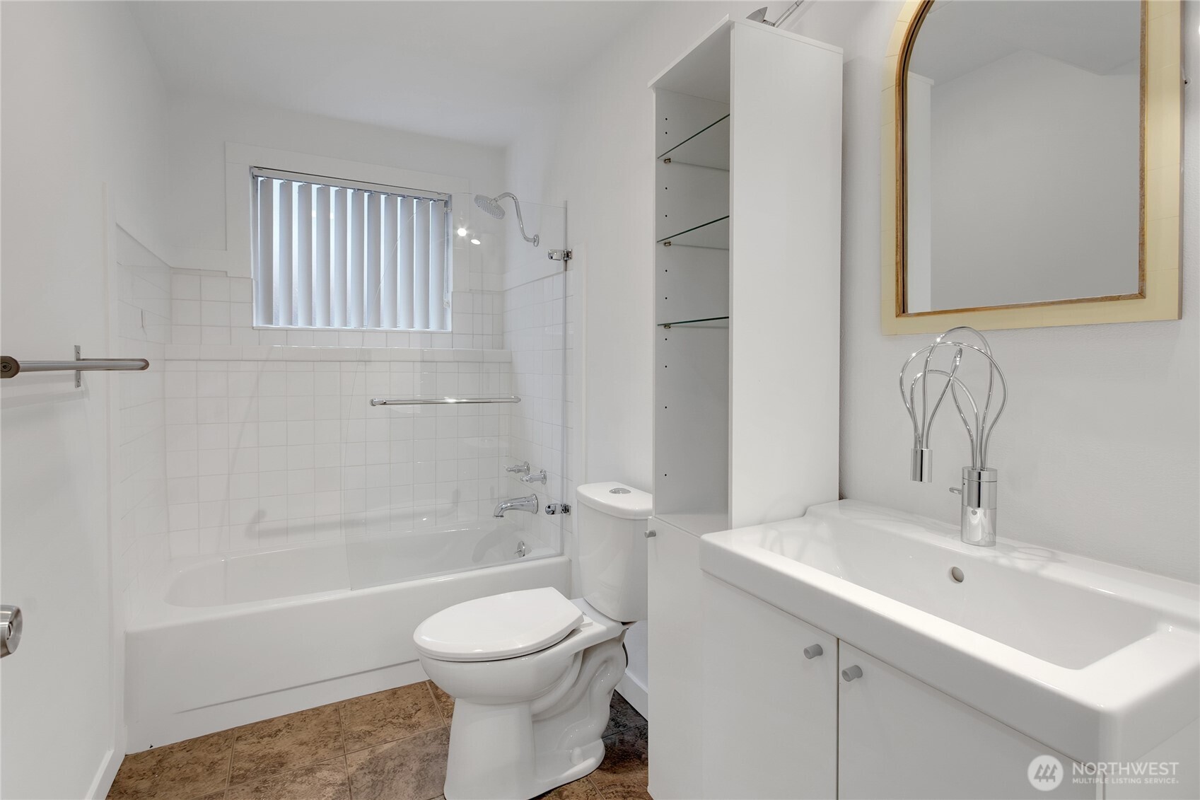 2356 South Angeline Street Seattle, WA 98108 - Photo 21 of 35 a bathroom with a toilet a sink a mirror and bathtub