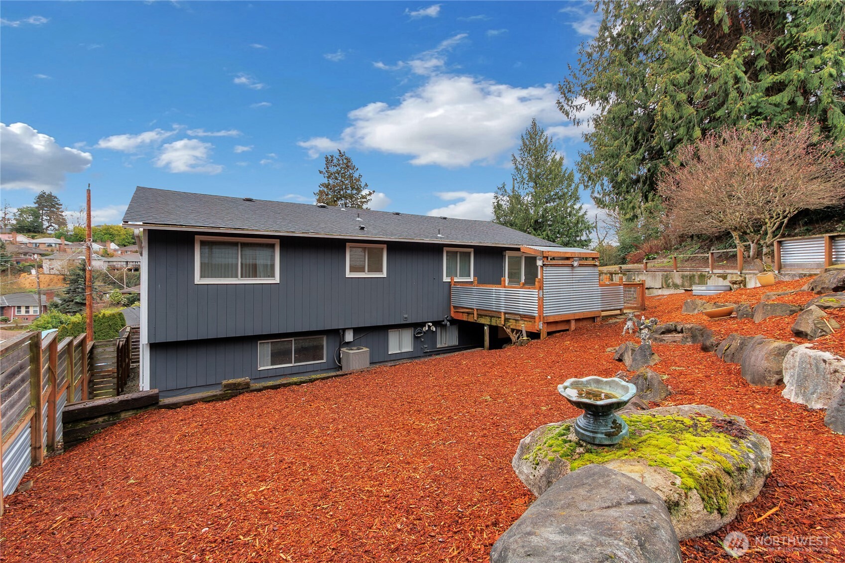 2356 South Angeline Street Seattle, WA 98108 - Photo 26 of 35 a view of a house with a backyard and sitting area