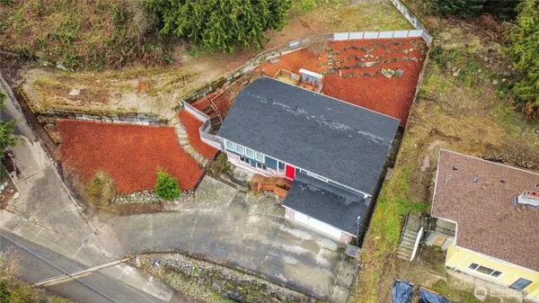 an aerial view of residential houses with outdoor space