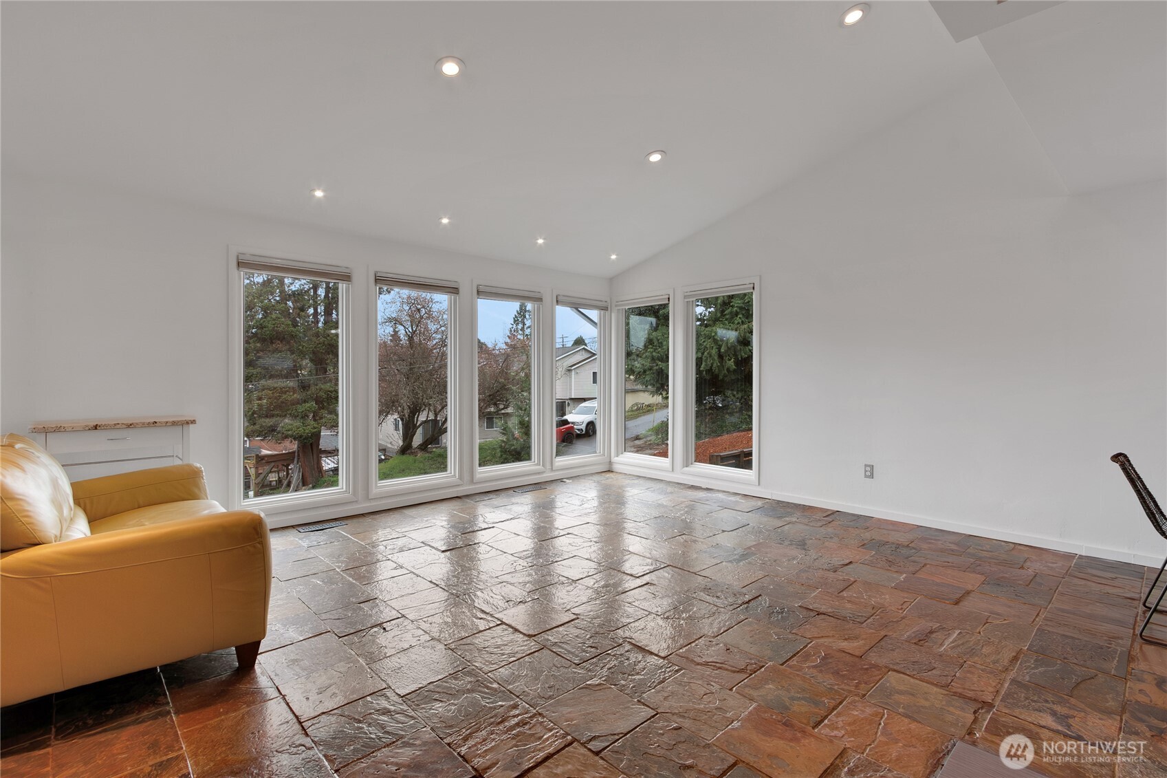 2356 South Angeline Street Seattle, WA 98108 - Photo 4 of 35 a view of an empty room with wooden floor and a window