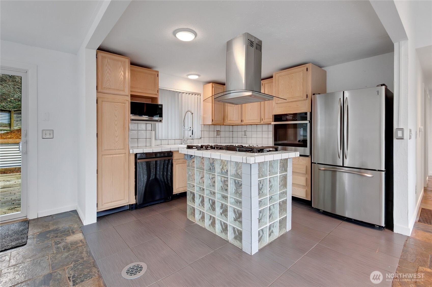 2356 South Angeline Street Seattle, WA 98108 - Photo 6 of 35 a kitchen with stainless steel appliances a refrigerator and a stove