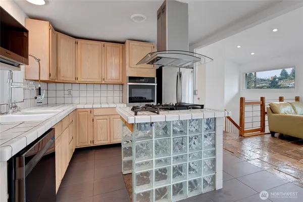 a kitchen with a sink cabinets and window
