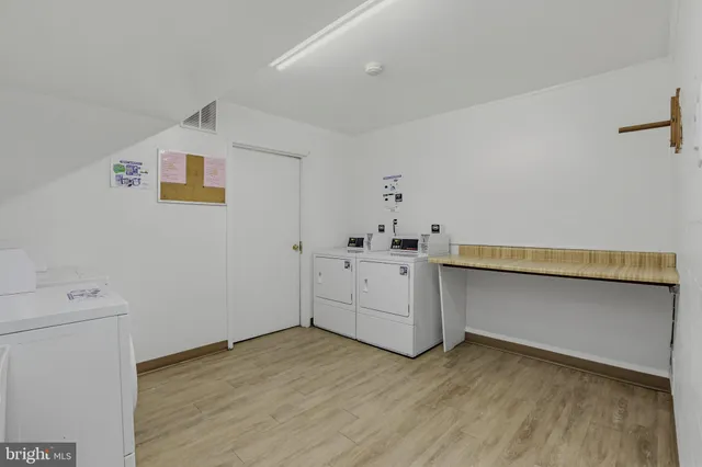 a view of a storage & utility room with wooden floor