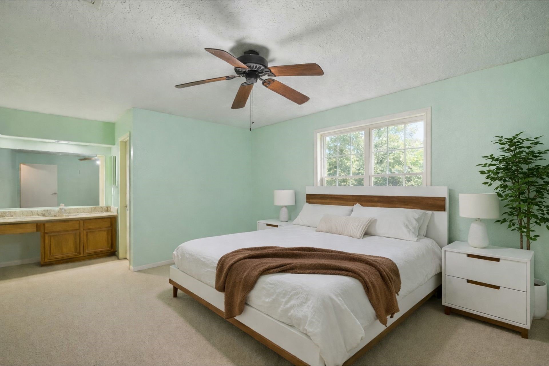 3615 Village Grove Drive Humble, TX 77396 - Photo 6 of 11 a bedroom with a large bed and a chandelier