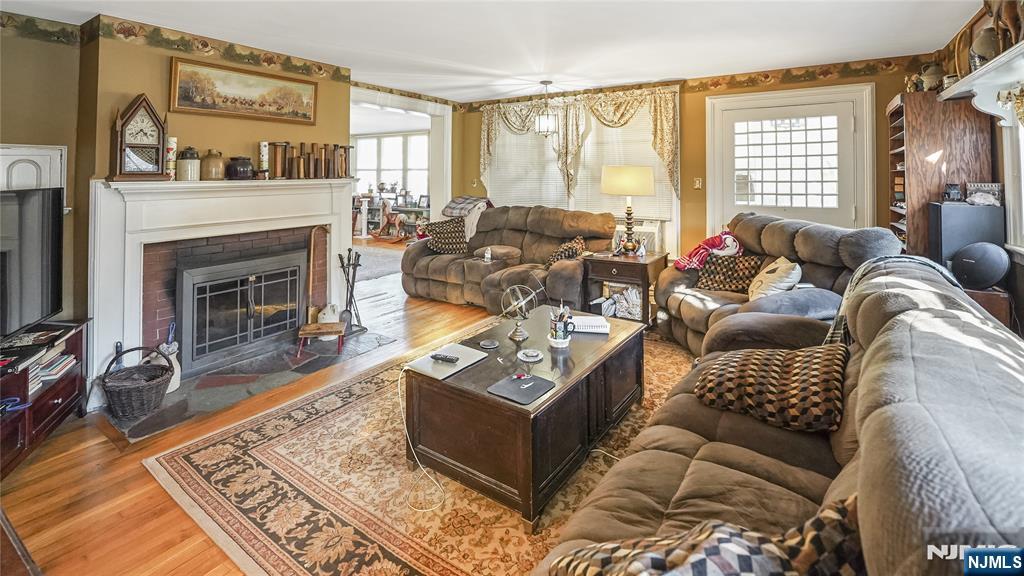 695 Ramapo Valley Road Oakland, NJ 07436 - Photo 21 of 42 a living room with furniture and a fireplace