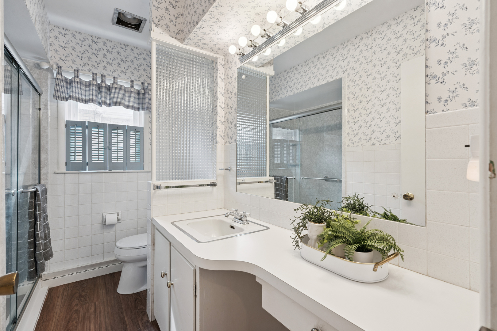 3104 15th Street A Moline, IL 61265 - Photo 19 of 31 a bathroom with a sink a toilet and shower