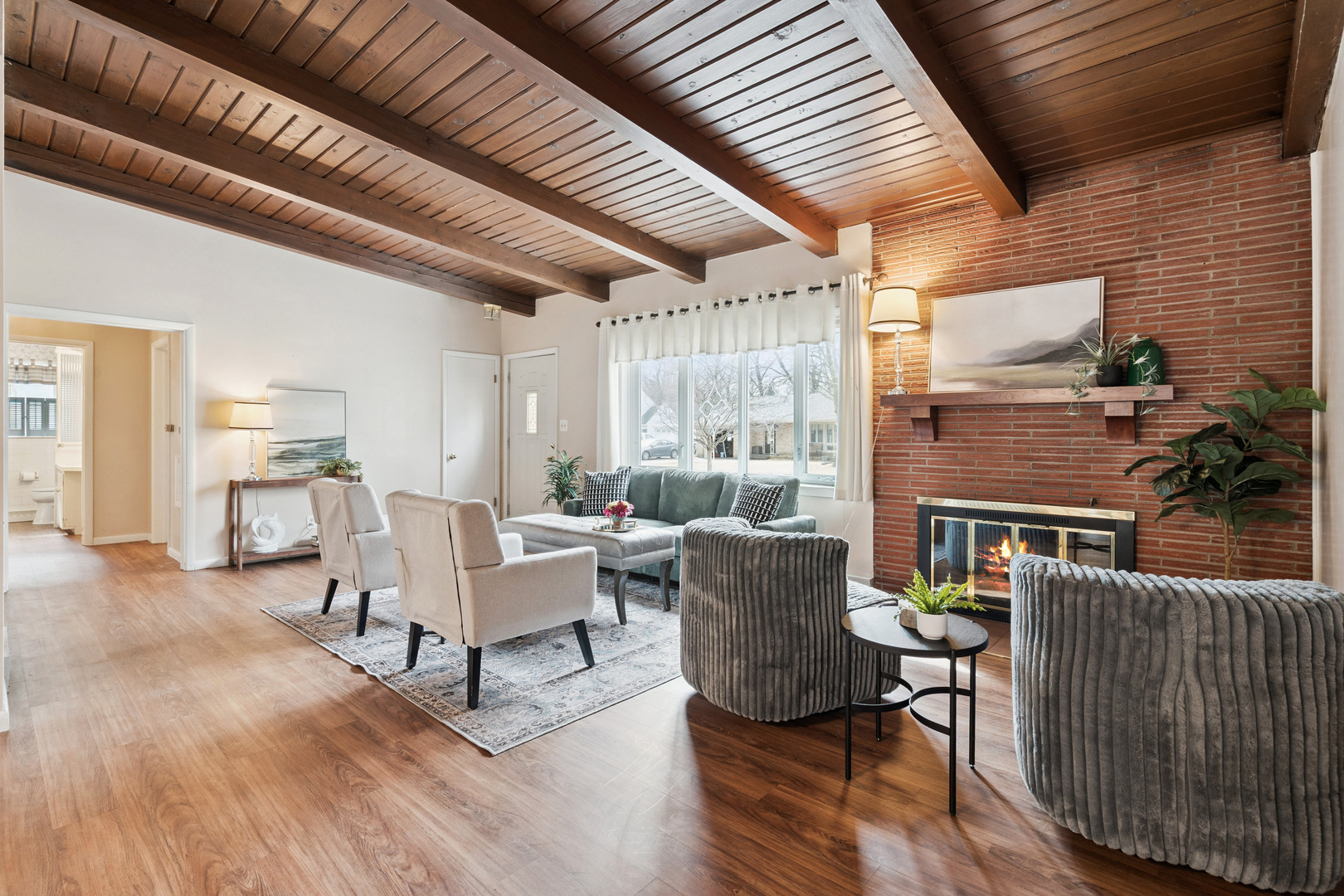 3104 15th Street A Moline, IL 61265 - Photo 2 of 31 a living room with furniture a wooden floor and a table