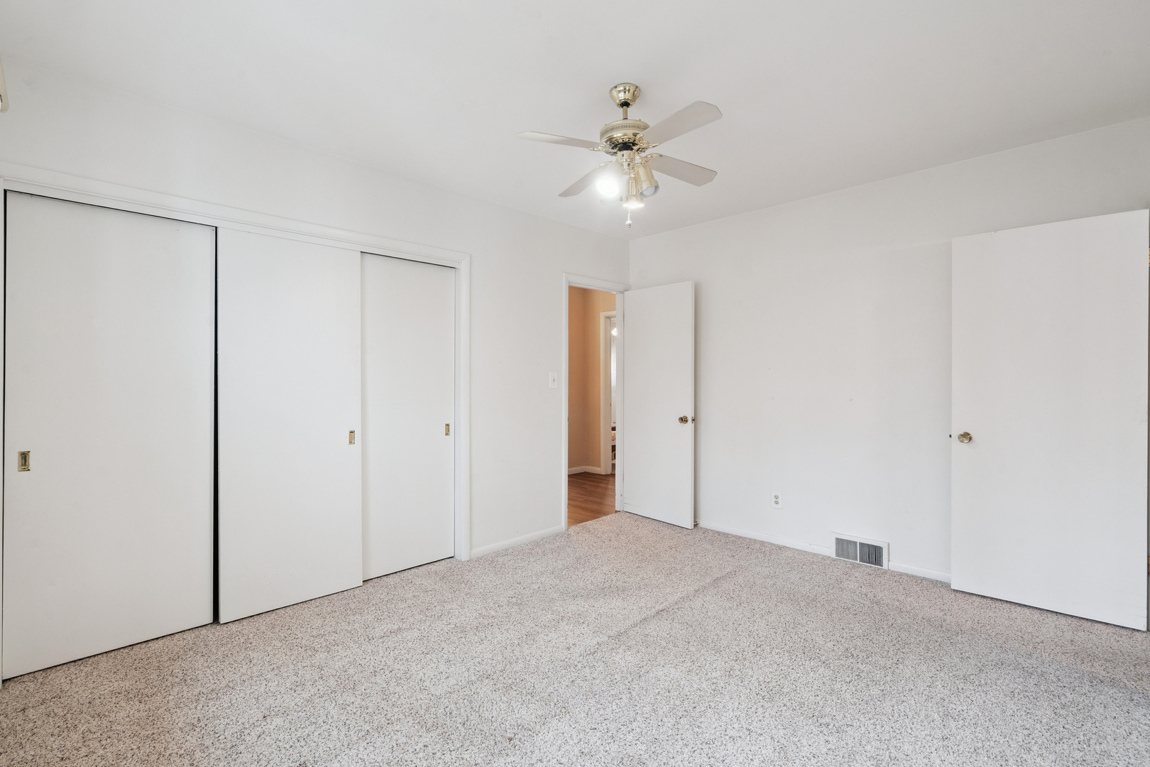 3104 15th Street A Moline, IL 61265 - Photo 23 of 31 a view of an empty room with a fan