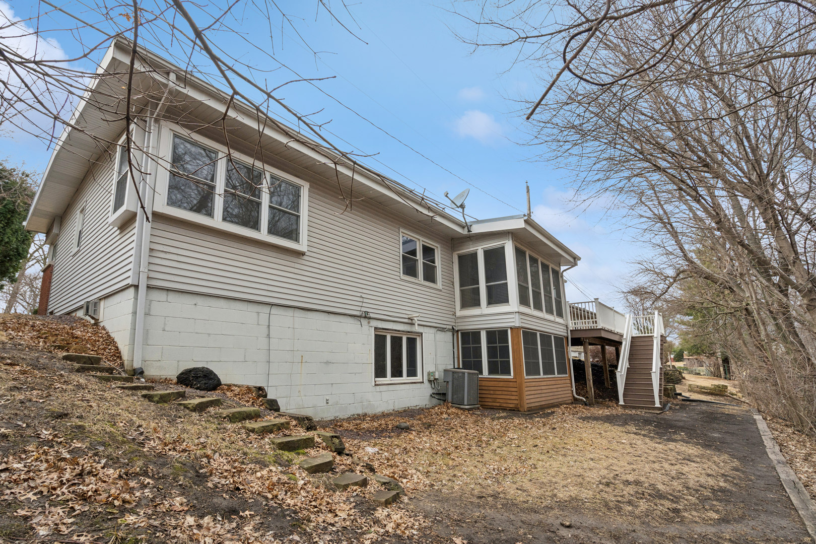 3104 15th Street A Moline, IL 61265 - Photo 28 of 31 a front view of a house with plants