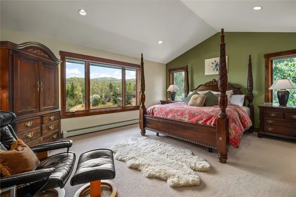 a bedroom with a bed and glass window