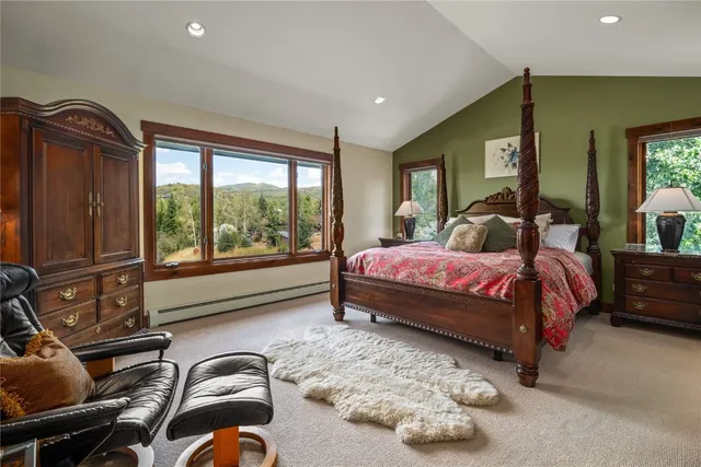 a bedroom with a bed and glass window