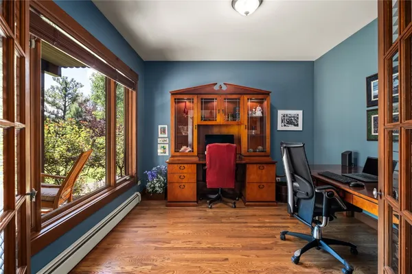 a view of an entryway with wooden floor