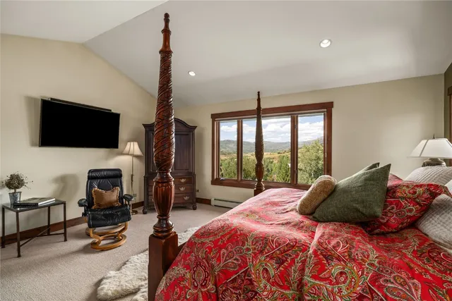 a spacious bathroom with a double vanity sink large mirror and a next to a window