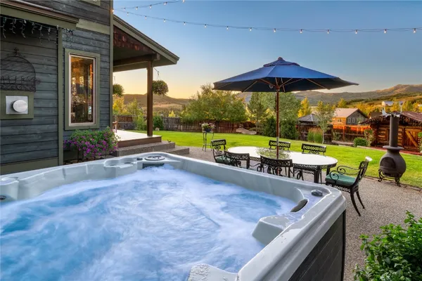 an outdoor space with patio and white umbrellas
