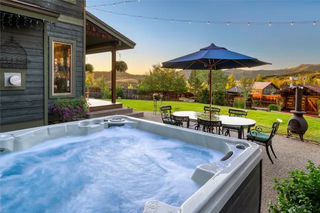 an outdoor space with patio and white umbrellas